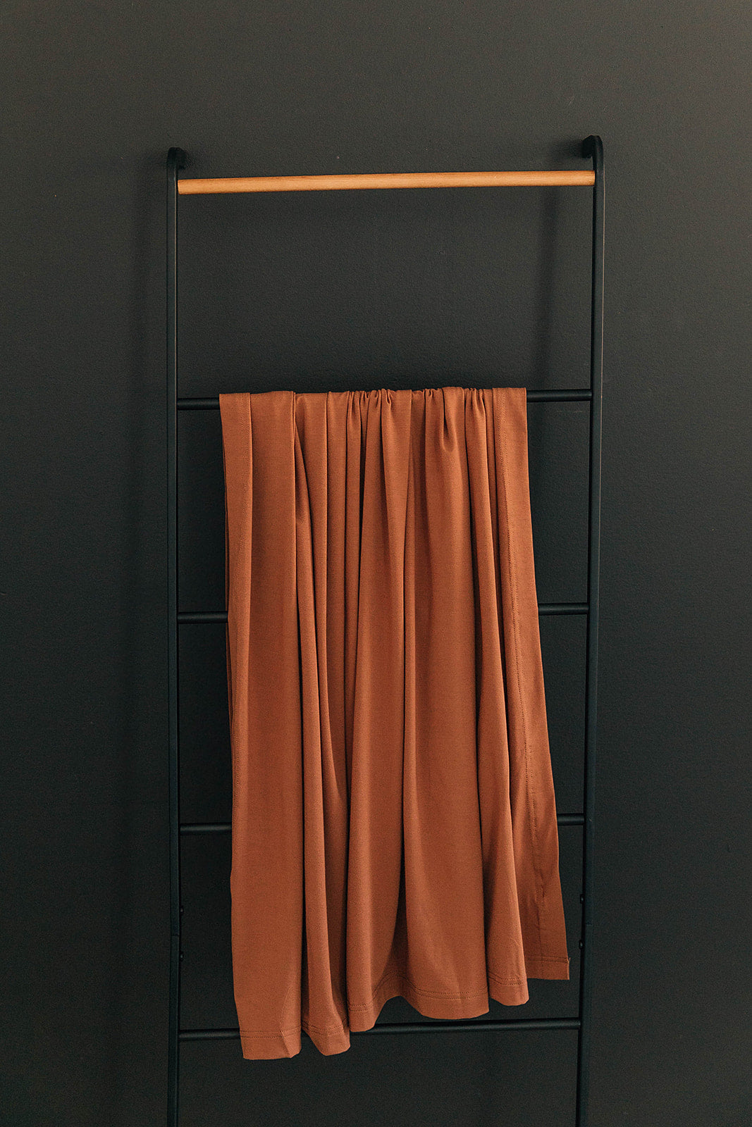 Mebie Baby Rust Stretch Swaddle. Mebie Baby Bamboo Stretch Swaddle. Gender Neutral for take home outfits and swaddling newborns.