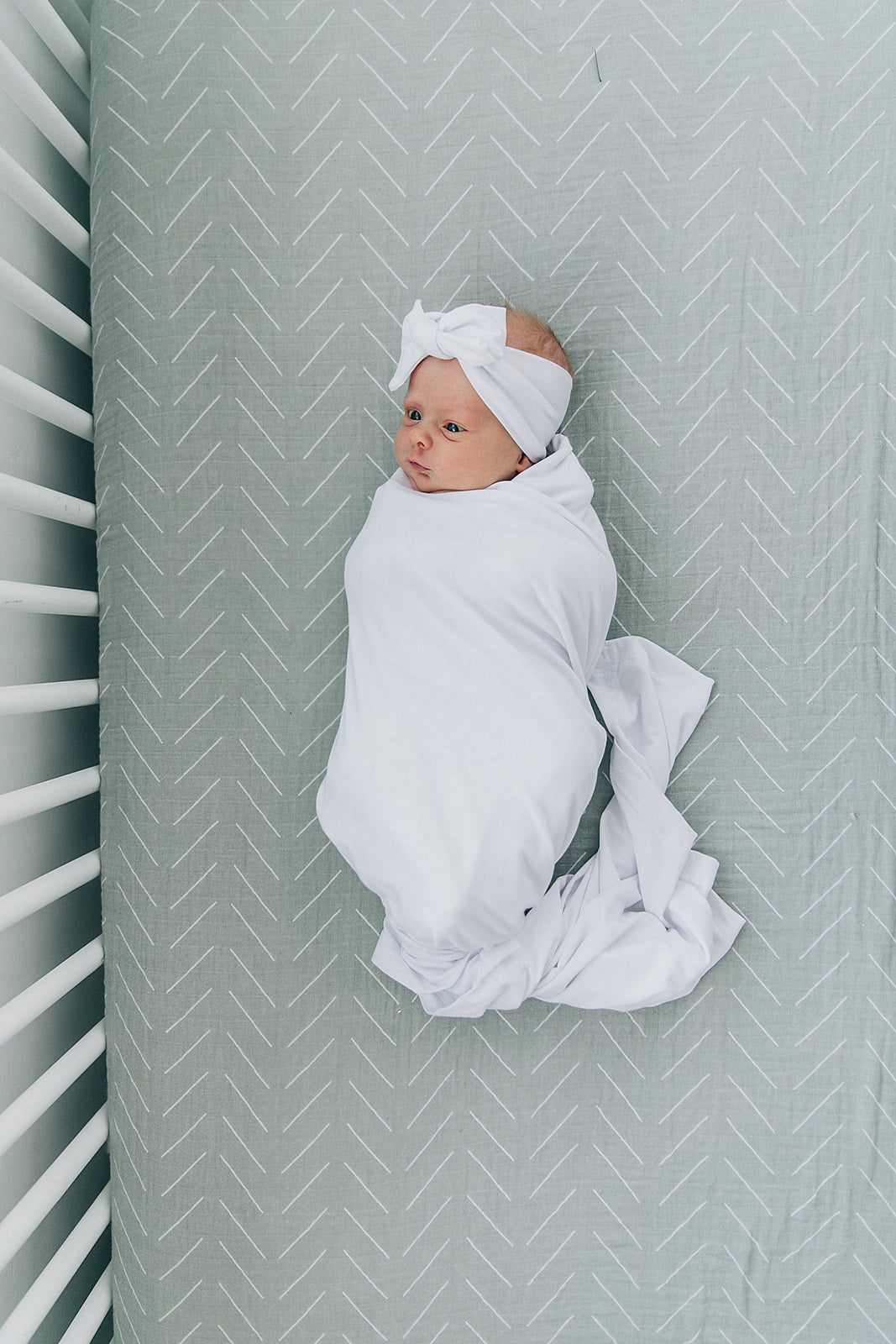 Mebie Baby White Stretch Swaddle. Mebie Baby Bamboo Stretch Swaddle. Gender Neutral for take home outfits and swaddling newborns.